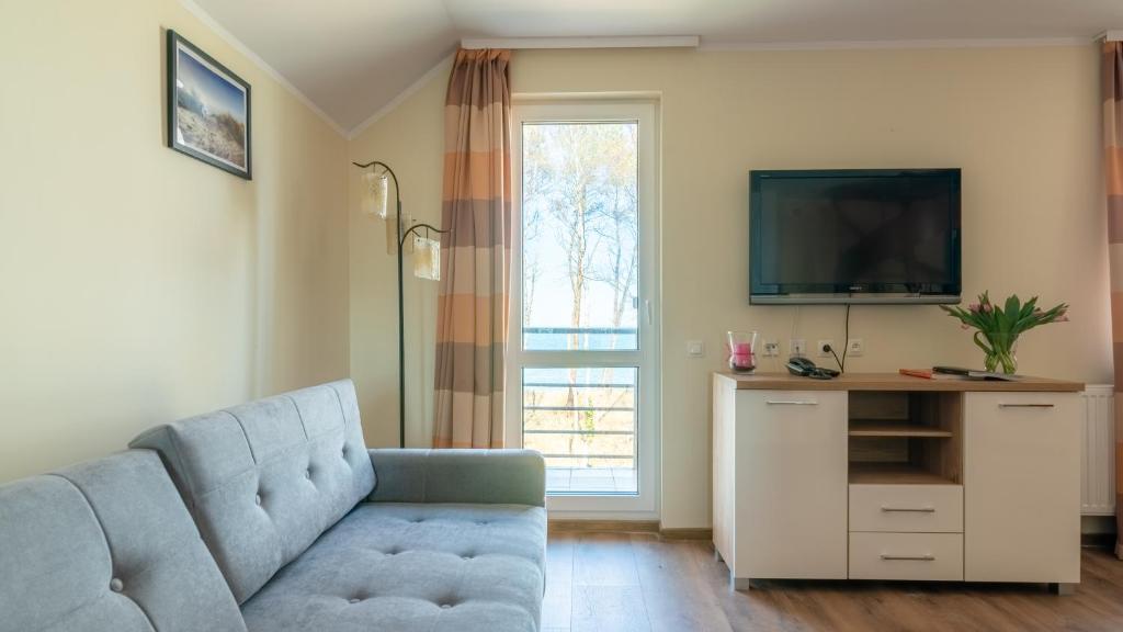 TV a/nebo společenská místnost v ubytování Ledan