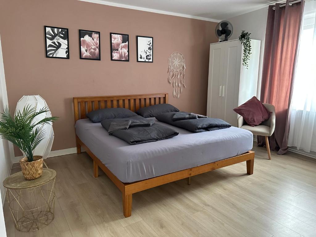 a bedroom with a large bed with pillows on it at Rooms4ring UG Romantic Bohemian Apartment Adenau in Adenau