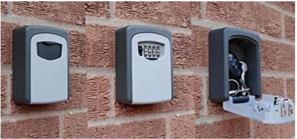 a brick wall with two soap dispensers on it at Vianatxiki in Viana