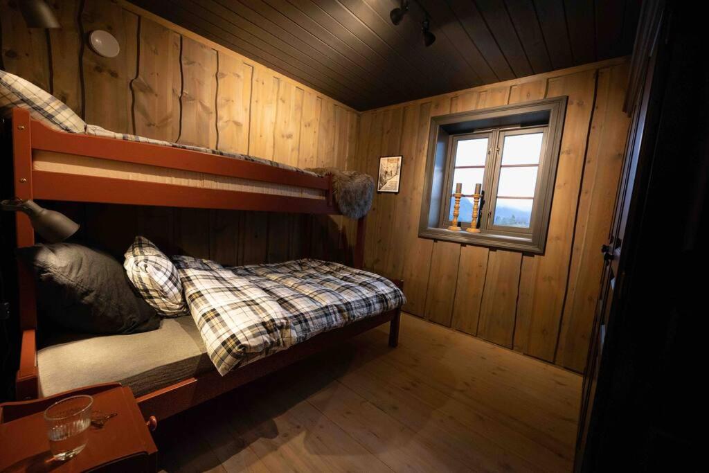 Postel nebo postele na pokoji v ubytování Roalden Mountain Lodge