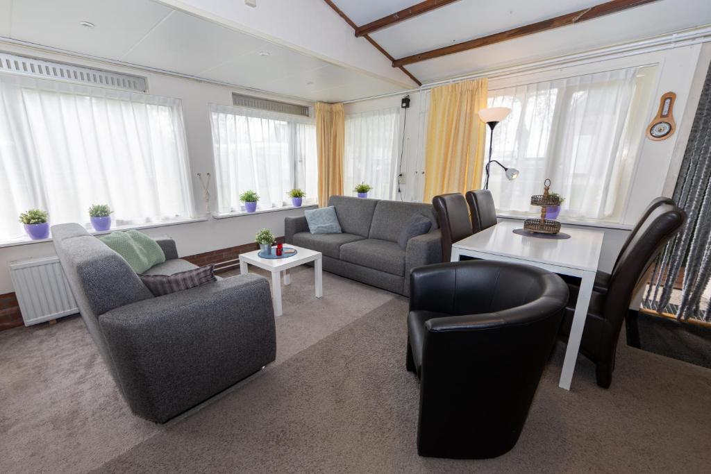 Uma área de estar em Hotel B&B d'Olde Smidse
