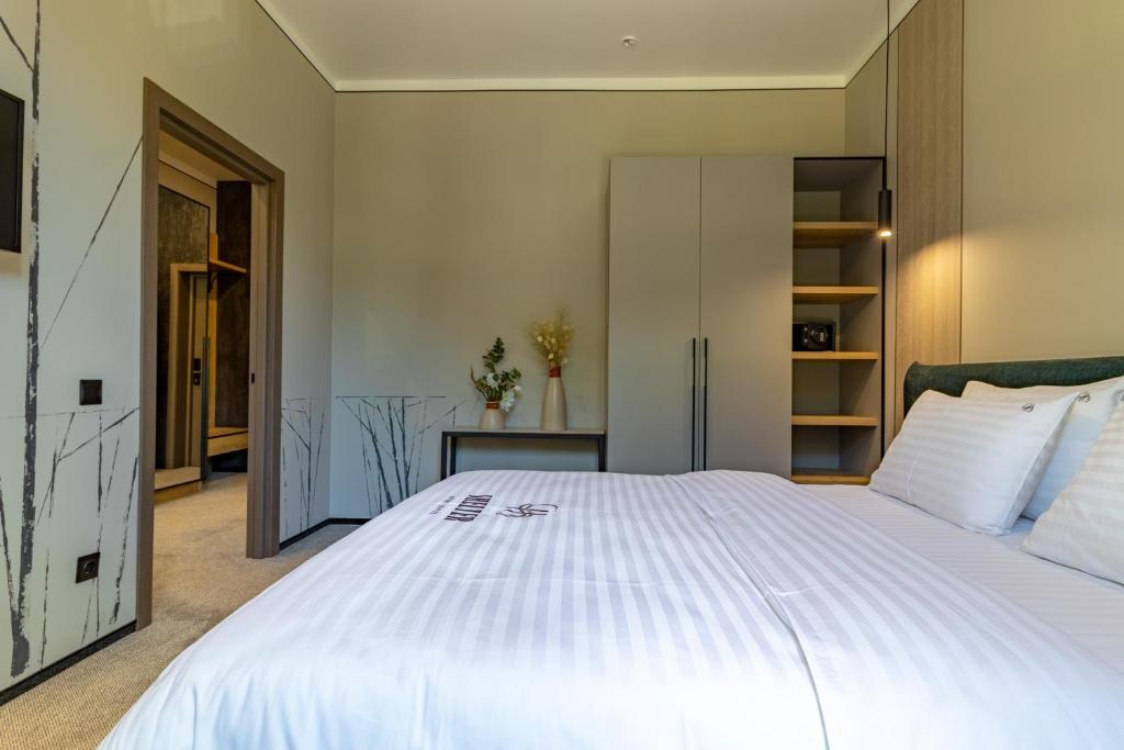 Postel nebo postele na pokoji v ubytování Shelter Apart Hotel