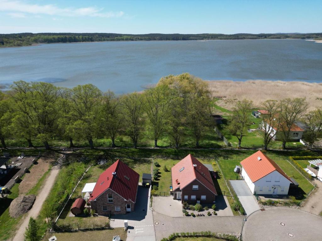an aerial view of a house next to the water at Ruth in Warin