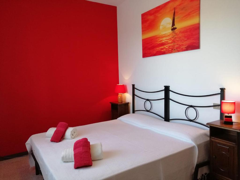 Postel nebo postele na pokoji v ubytování Agriturismo Podere Verdicchio