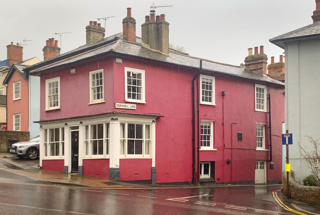 a red building on the side of a street at The Red House Maldon in Maldon