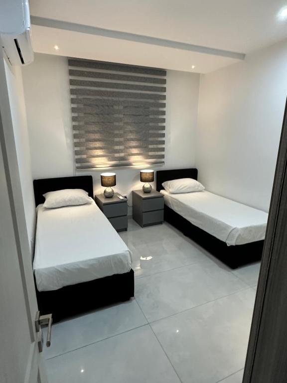 Postel nebo postele na pokoji v ubytování ONE100 apartments