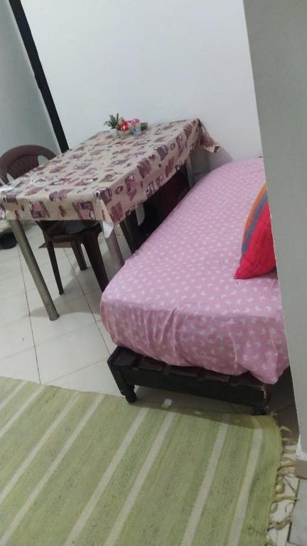 a table and a bed in a room with a table at appartement one room in Casablanca