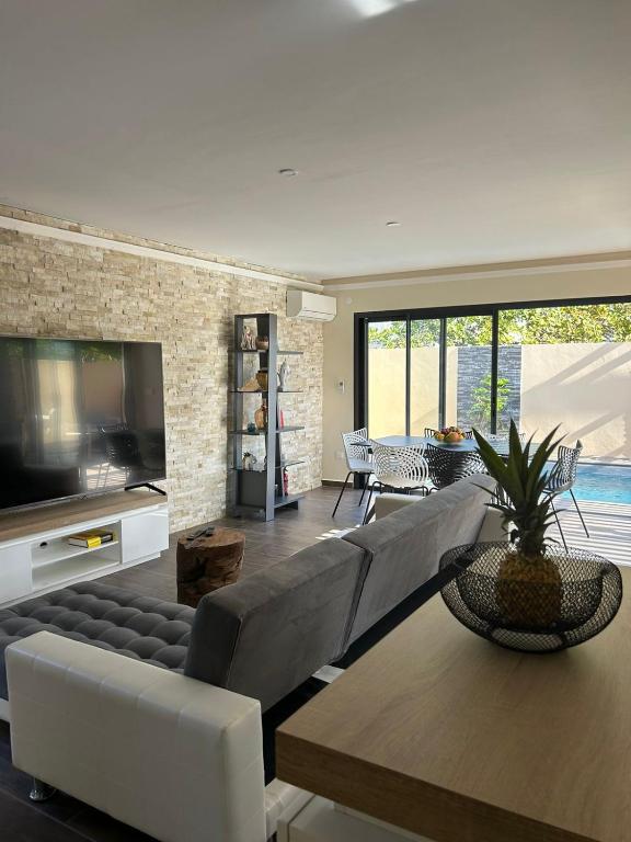 Posezení v ubytování Les Villas Jasmin Standing Piscine Chauffée Jacuzzi 5 Ch 14 Pers