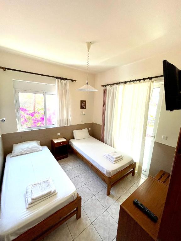 Postel nebo postele na pokoji v ubytování SCALA APARTS & STUDIOS - Rhodes