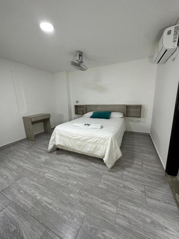 מיטה או מיטות בחדר ב-Hotel Plataneras Caney