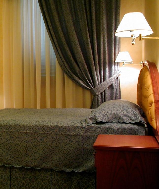 Postel nebo postele na pokoji v ubytování Hotel Antico Masetto