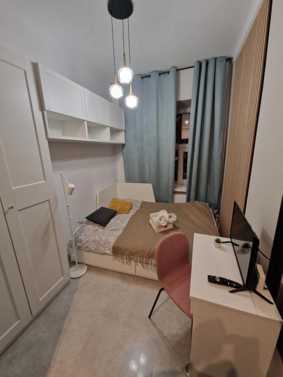 Posteľ alebo postele v izbe v ubytovaní City Center Studio Apartments