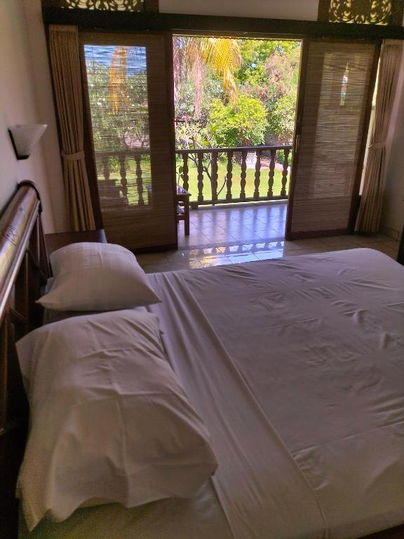 Postel nebo postele na pokoji v ubytování Hotel SeaSide lovina