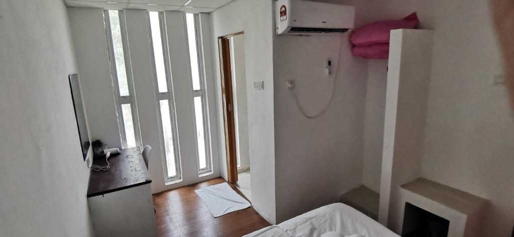 Postel nebo postele na pokoji v ubytování Tang Hotel