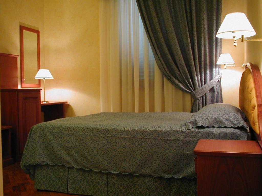Postel nebo postele na pokoji v ubytování Hotel Antico Masetto