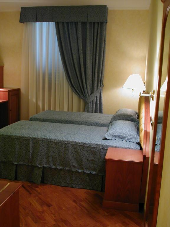 Postel nebo postele na pokoji v ubytování Hotel Antico Masetto