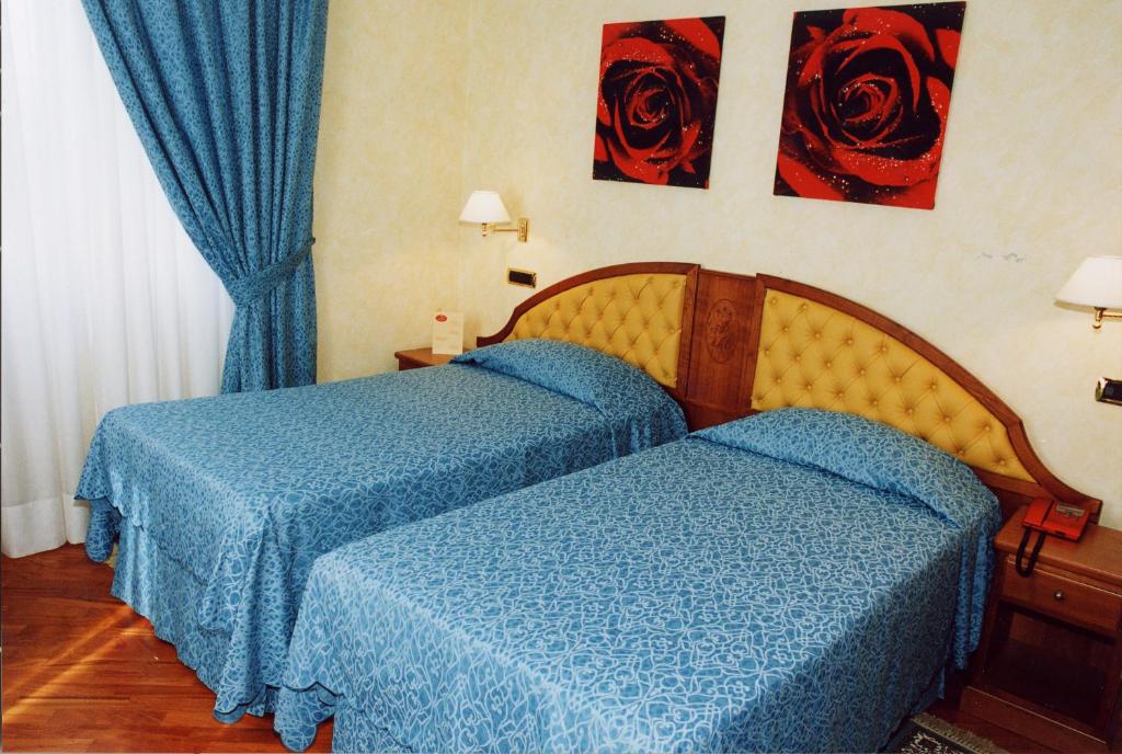 Postel nebo postele na pokoji v ubytování Hotel Antico Masetto