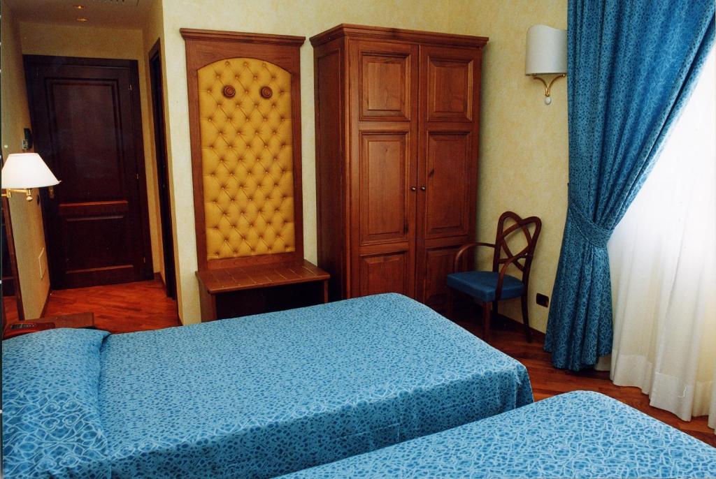 Postel nebo postele na pokoji v ubytování Hotel Antico Masetto