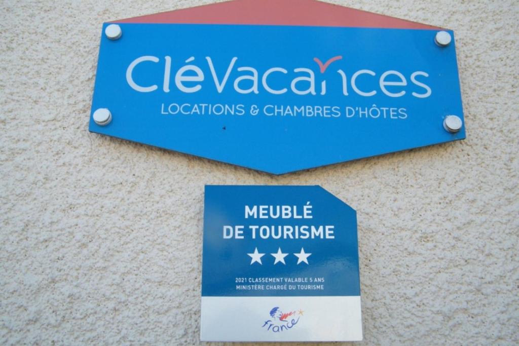 a sign on a wall that reads clevalgas locations and champions phones at Gîte Cathédrale Waldner de Freundstein Label "Clévacances" in Strasbourg