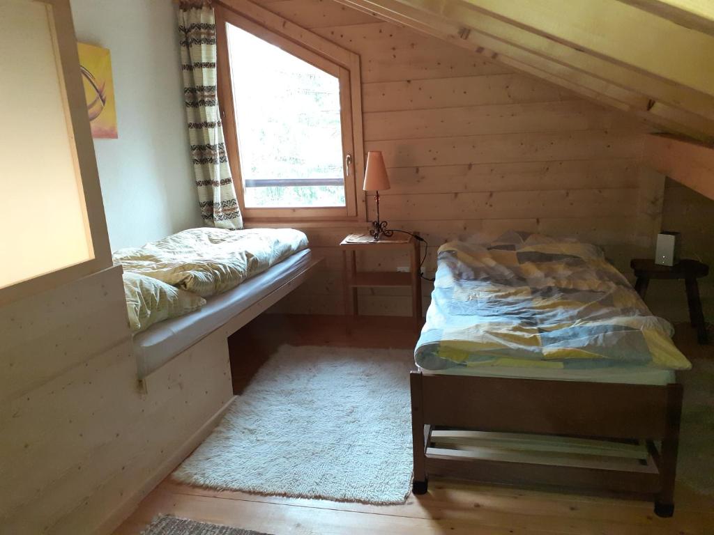 Postel nebo postele na pokoji v ubytování Les loulou 2