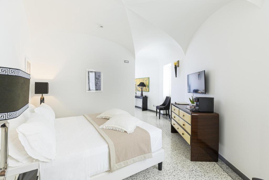 Postel nebo postele na pokoji v ubytování Roccobarocco Boutique Hotel