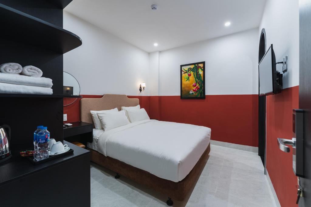 Giường trong phòng chung tại Q Boutique Hotel