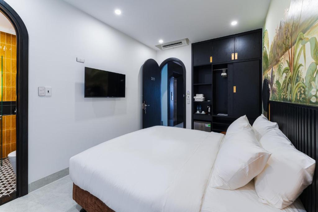 Giường trong phòng chung tại Q Boutique Hotel