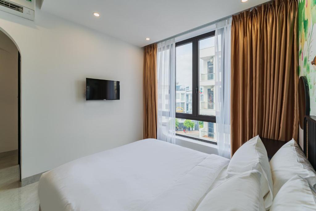 Giường trong phòng chung tại Q Boutique Hotel