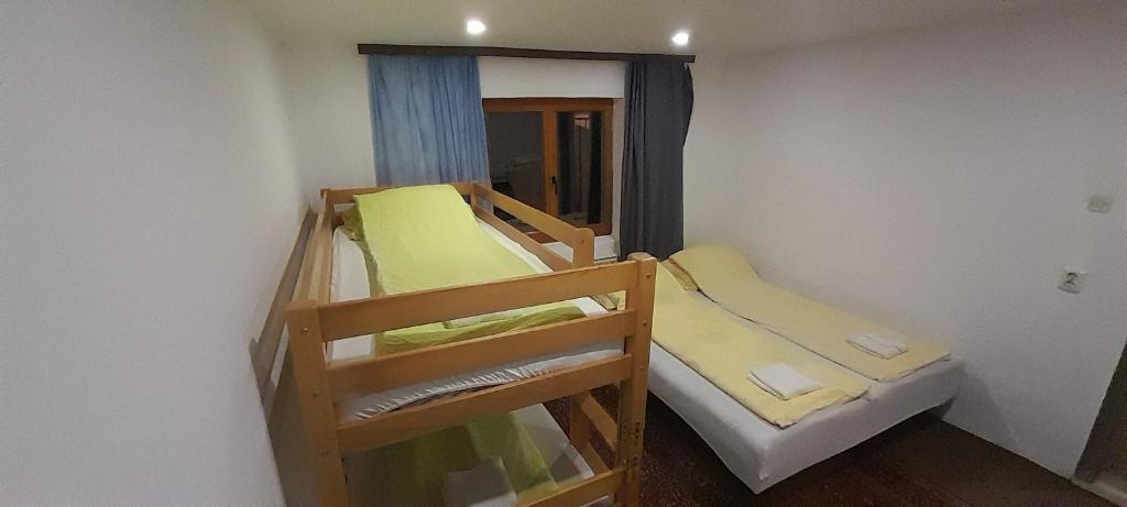Krevet ili kreveti u jedinici u okviru objekta Mahala Apartments - Free Garage
