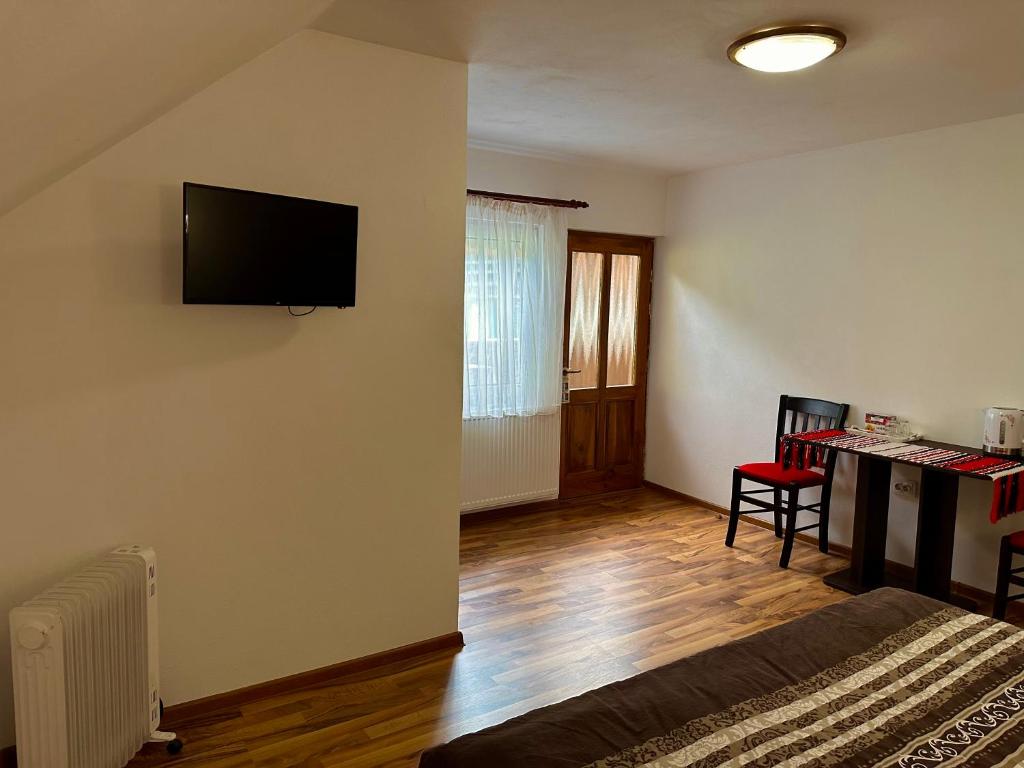 TV a/nebo společenská místnost v ubytování Casa Aurelia