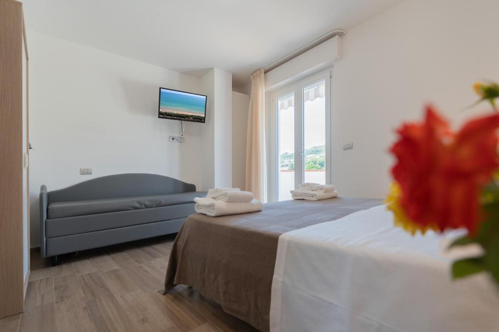 Postel nebo postele na pokoji v ubytování Pineto Resort
