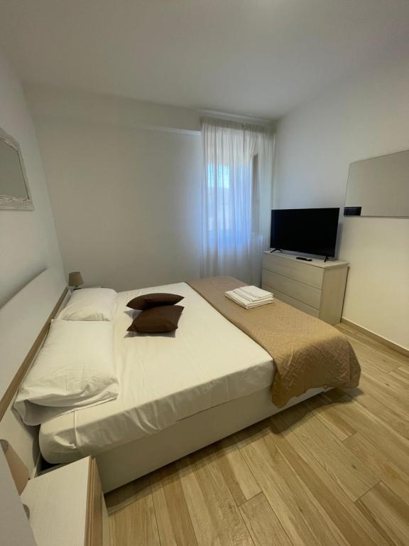 A bed or beds in a room at NEWHOUSE ROOFTOP - Super Penthouse Seaview