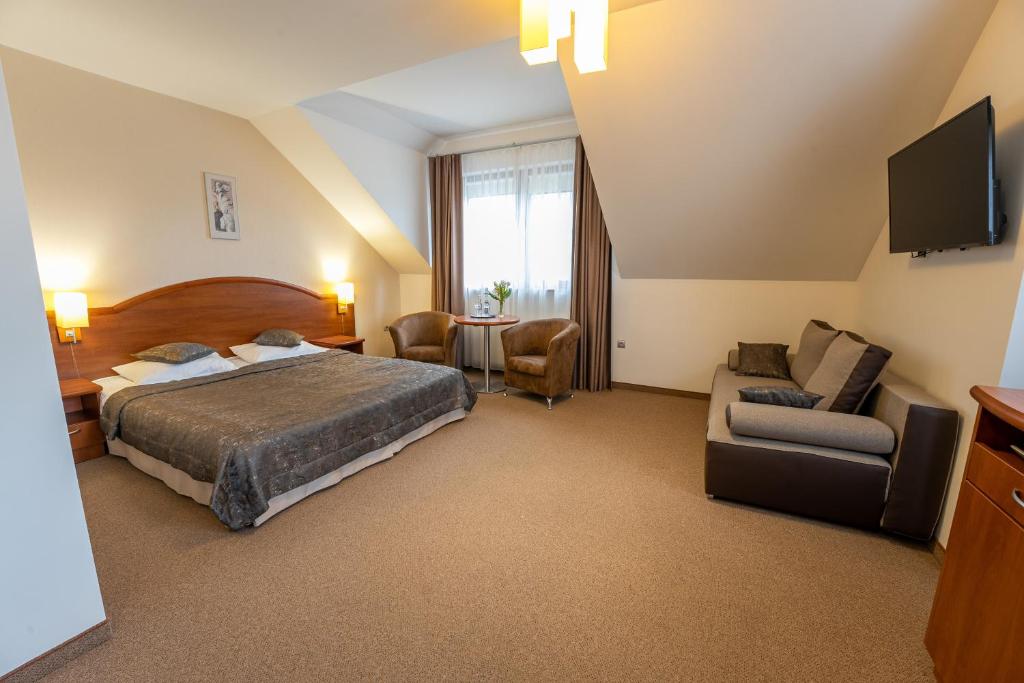 Postel nebo postele na pokoji v ubytování Hotel Szelców