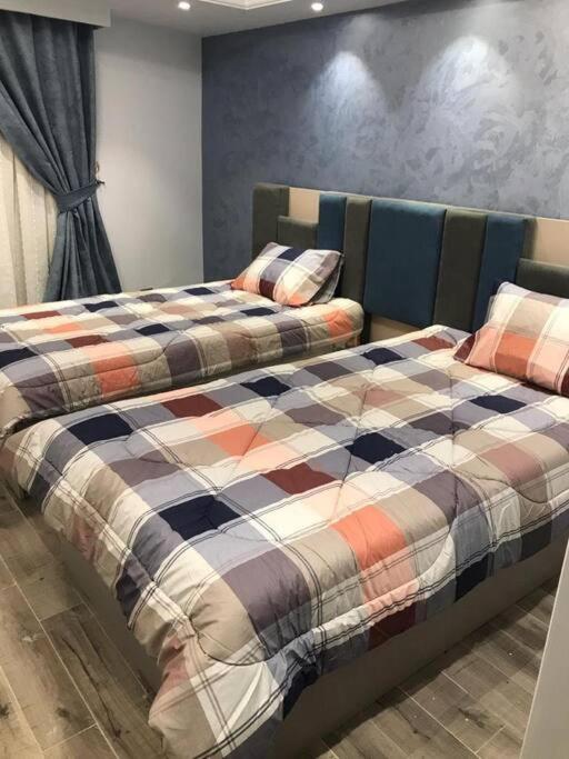 Postel nebo postele na pokoji v ubytování Jood Residences Apartment