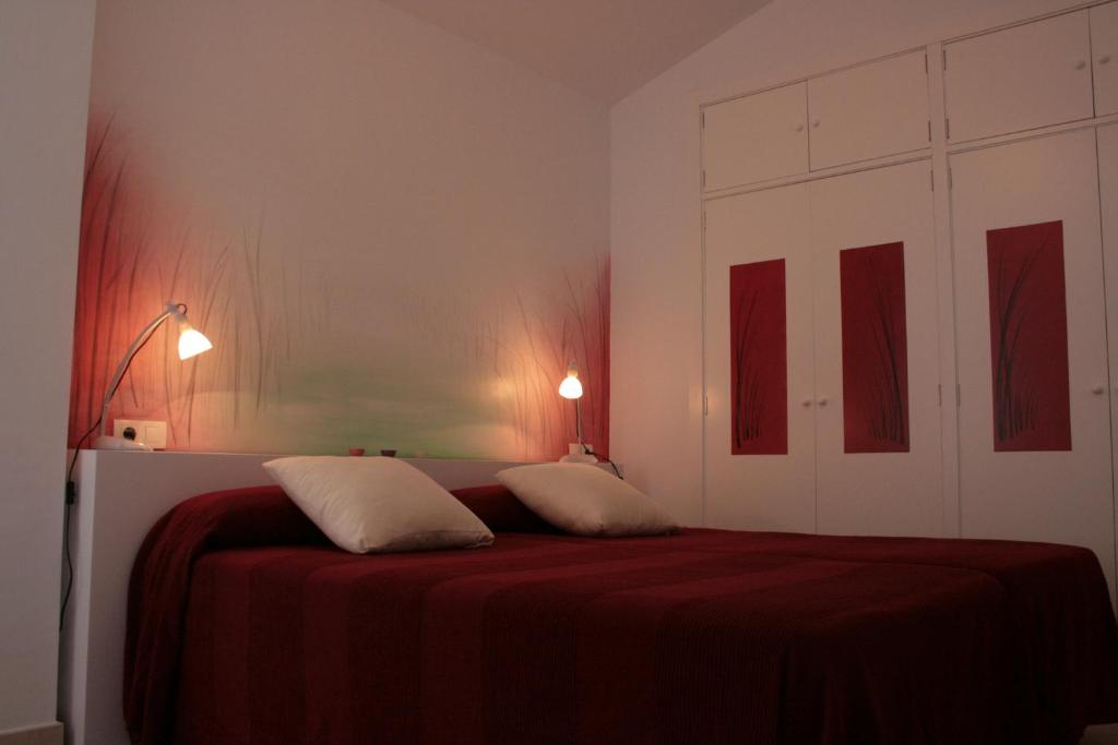 Posteľ alebo postele v izbe v ubytovaní Apartamentos La Casa Pintada