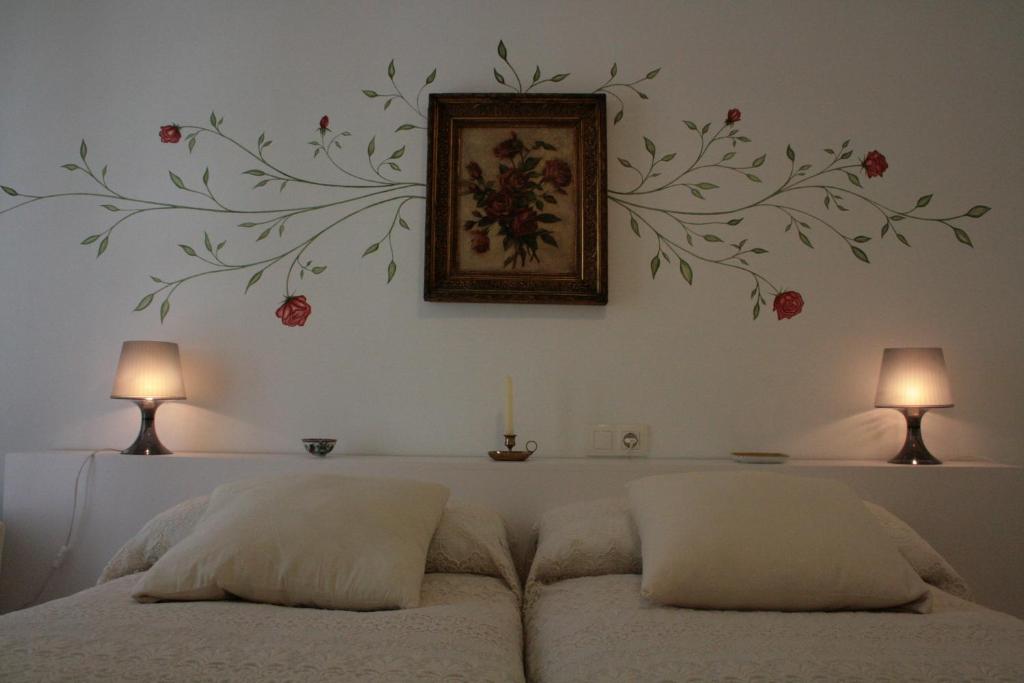 Posteľ alebo postele v izbe v ubytovaní Apartamentos La Casa Pintada