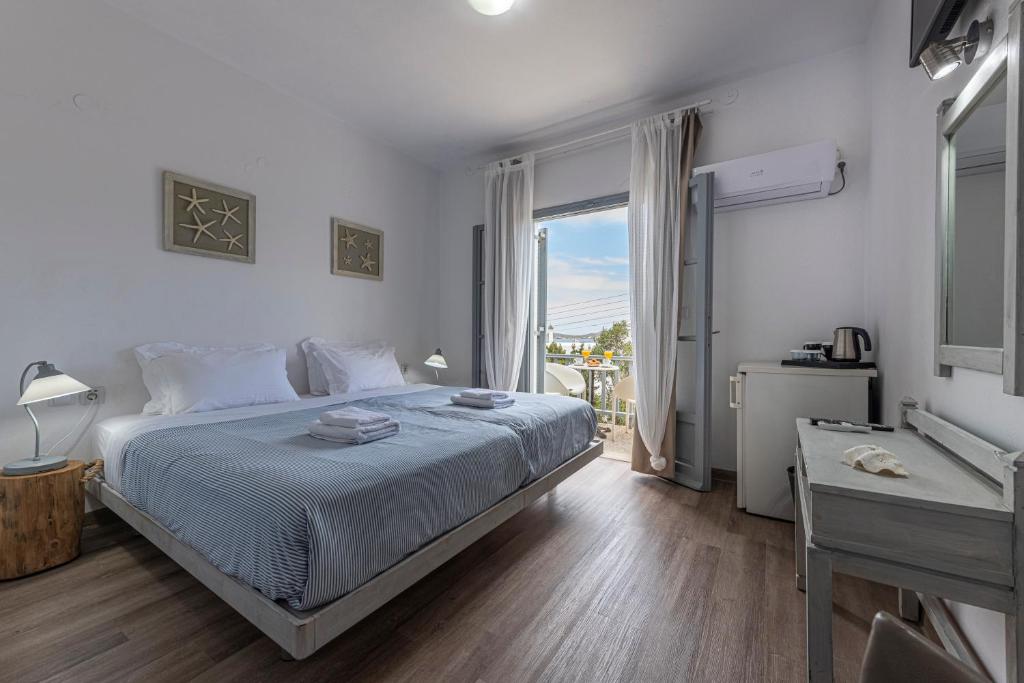 Postel nebo postele na pokoji v ubytování Hotel Manto