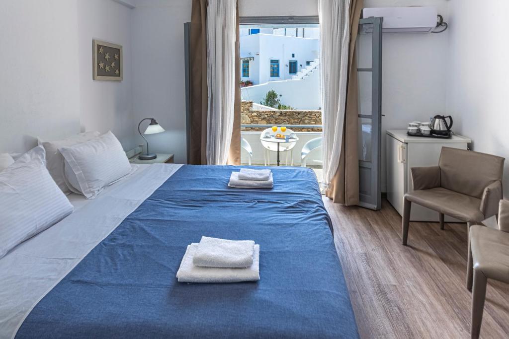 Postel nebo postele na pokoji v ubytování Hotel Manto