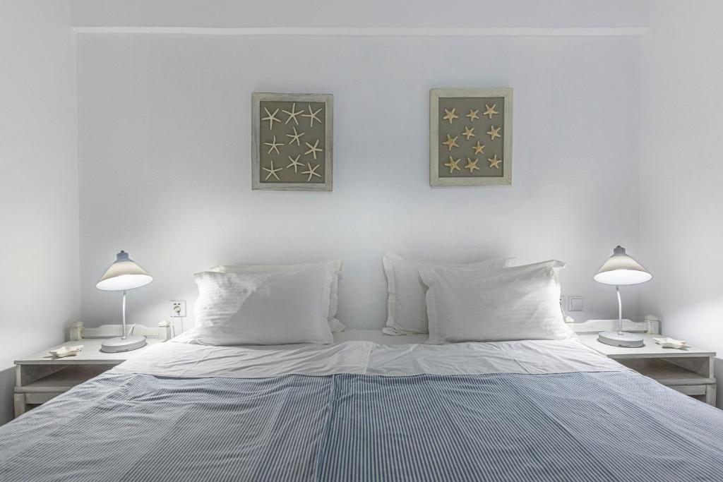 Postel nebo postele na pokoji v ubytování Hotel Manto