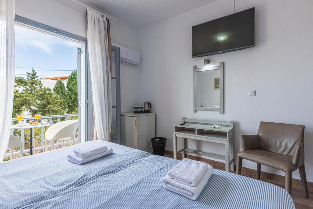 Postel nebo postele na pokoji v ubytování Hotel Manto