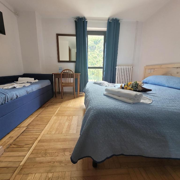 Postel nebo postele na pokoji v ubytování Chalet Monte Nebius