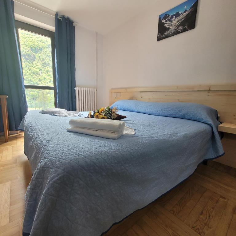 Postel nebo postele na pokoji v ubytování Chalet Monte Nebius