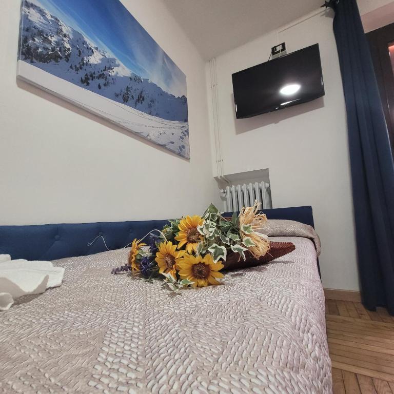 Postel nebo postele na pokoji v ubytování Chalet Monte Nebius