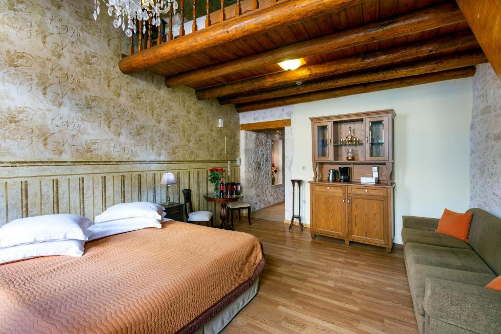 Postel nebo postele na pokoji v ubytování Casa Moazzo Suites and Apartments