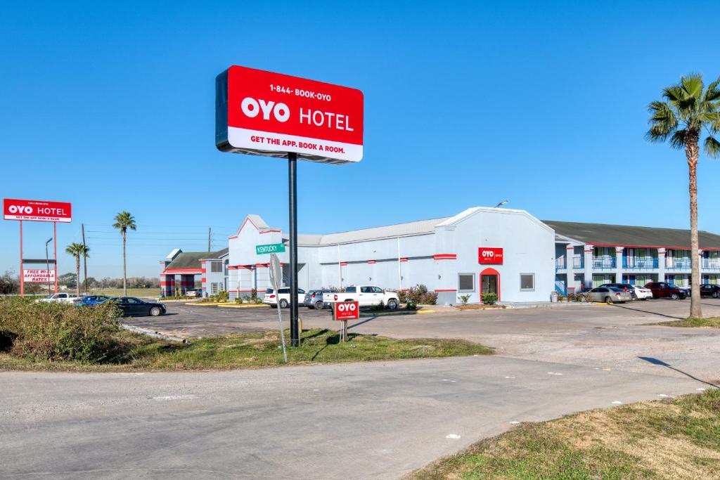 motel sign in front of a parking lot at OYO Hotel Rosenberg TX I-69 in Rosenberg