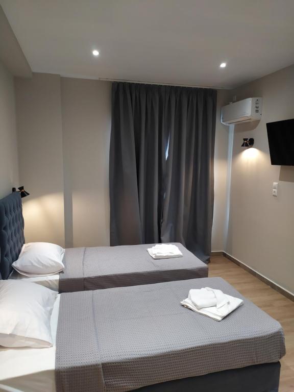 Postel nebo postele na pokoji v ubytování New Amaryllis Hotel