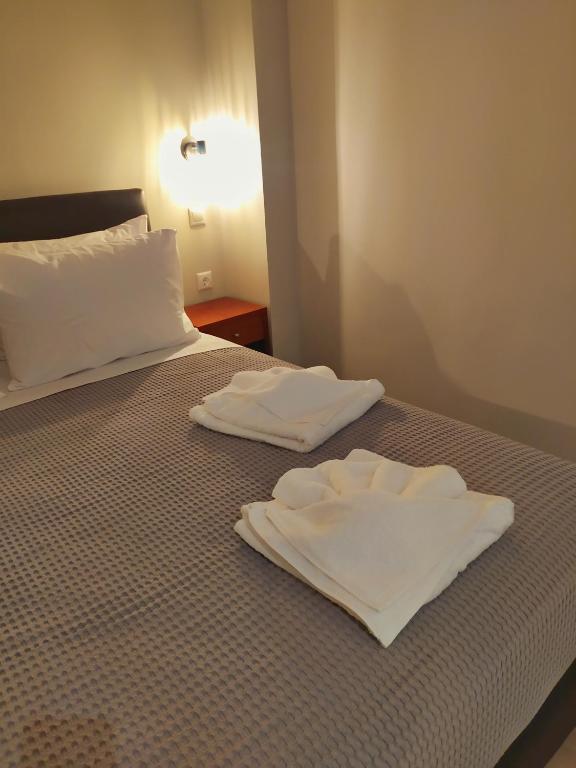 Postel nebo postele na pokoji v ubytování New Amaryllis Hotel