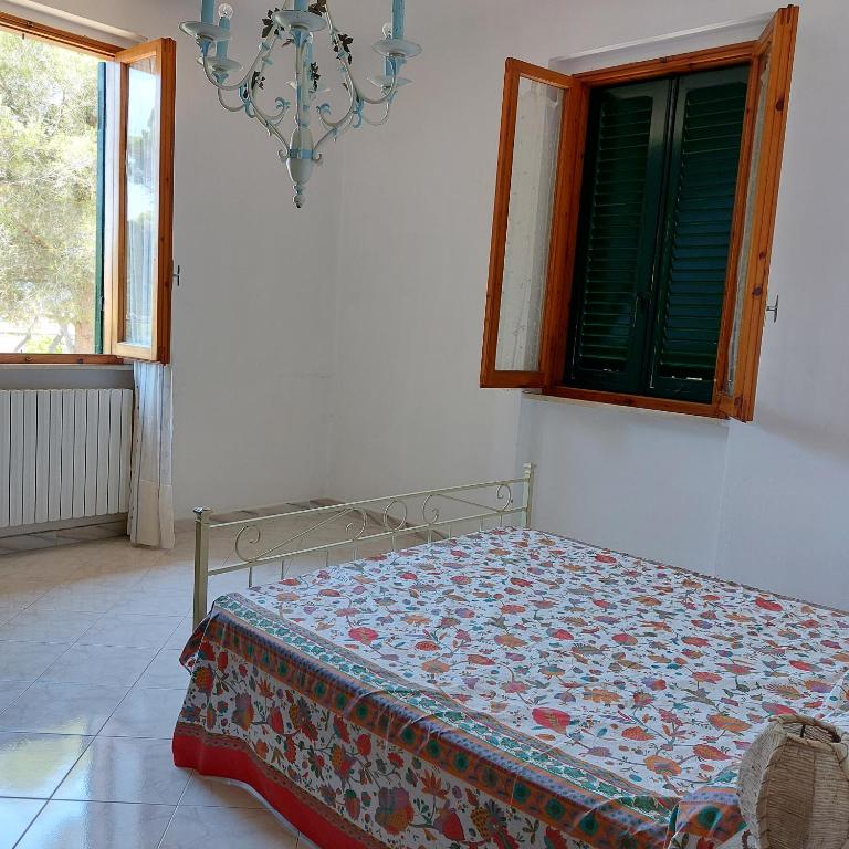 Postel nebo postele na pokoji v ubytování Appartamento a due passi dal mare a Quercianella