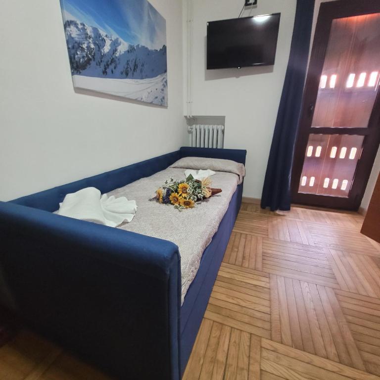 Postel nebo postele na pokoji v ubytování Chalet Monte Nebius