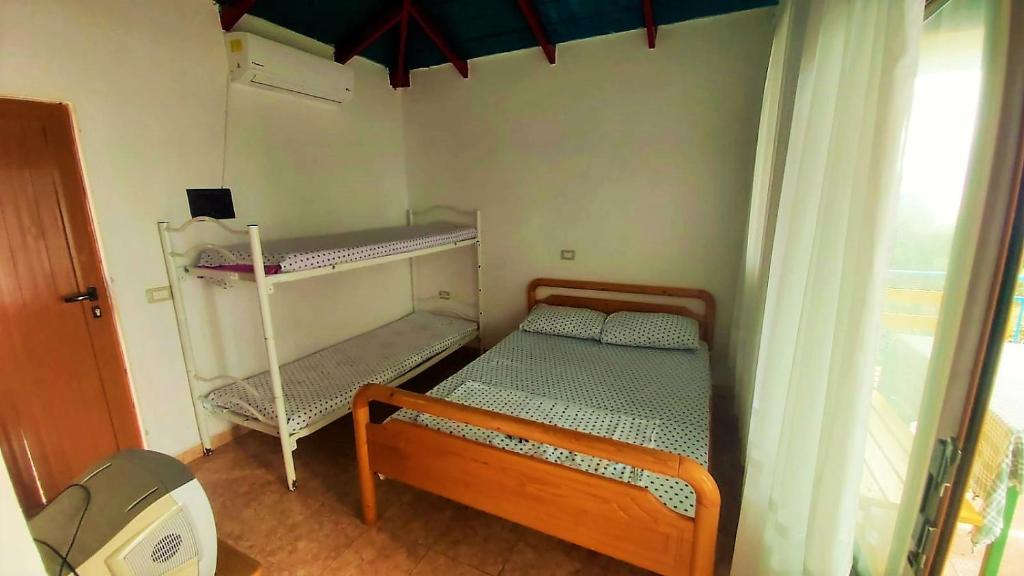 Fourth Room of Cozy Beachside Haven - Panoramic Radhime Retreat with Balcony Dining - Image 6